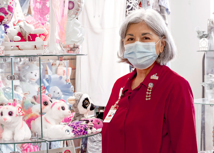 Woman volunteering at gift shop