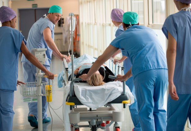 Emergency doctors and nurses with a patient on a gurney