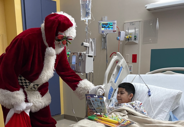 Santa brings cheer to a patient at South Texas Health System, Edinburg, Texas