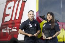Edgar Gonzalez, EMT-Basic, and Brooklyn Avila, EMT-Basic, receive their Hometown Heroes Award