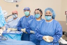 Doctors standing in operating room