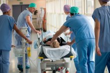 Emergency doctors and nurses with a patient on a gurney