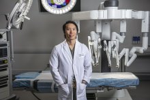 Photo of Dr. Kim in a surgical suite