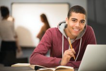 Happy adult student in class
