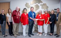 Dr. Rudy Alvarez giving a check to members of the Auxiliary to South Texas Health System