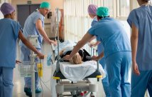 Emergency doctors and nurses with a patient on a gurney