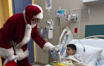 Santa brings cheer to a patient at South Texas Health System, Edinburg, Texas
