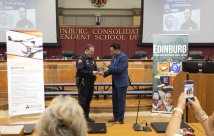 Chief Perez receiving his hometown heroes award from STHS